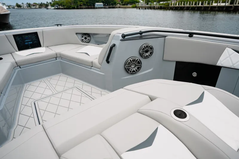  Yacht Photos Pics Luxurious interior of 2026 Deep Impact 499 Sport boat with modern seating and speakers.