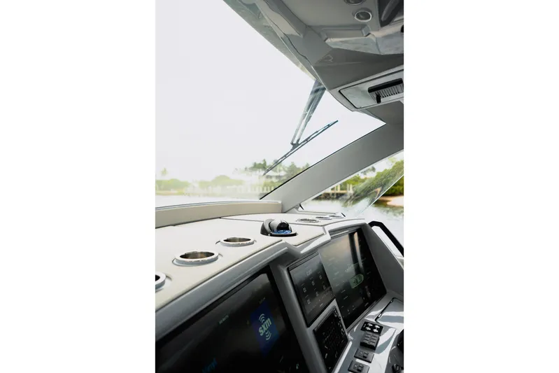  Yacht Photos Pics Interior view of 2026 Deep Impact 499 Sport boat cockpit with advanced navigation displays.