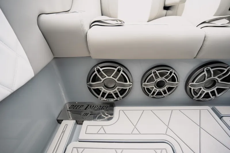  Yacht Photos Pics 2026 Deep Impact 499 Sport boat interior with premium speakers and sleek seating design.