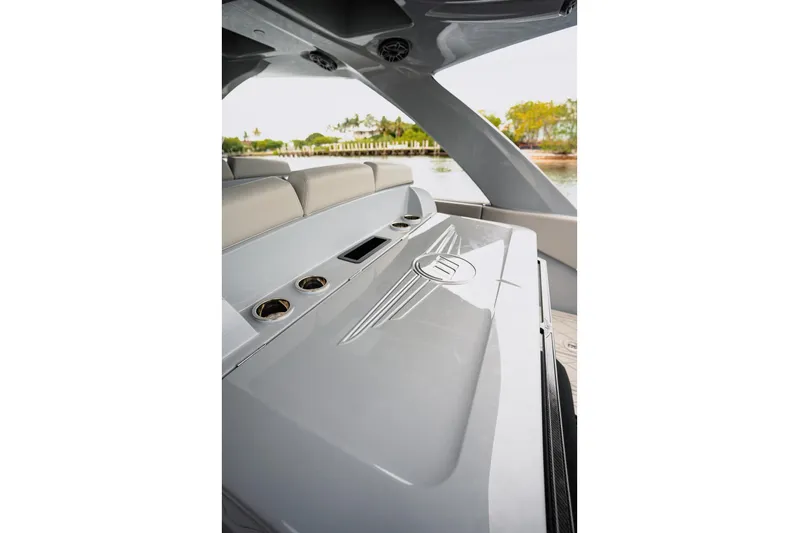  Yacht Photos Pics 2026 Deep Impact 499 Sport boat interior with sleek design and cup holders.