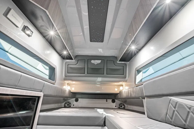  Yacht Photos Pics Luxurious interior of 2026 Deep Impact 499 Sport boat with modern design and ambient lighting.