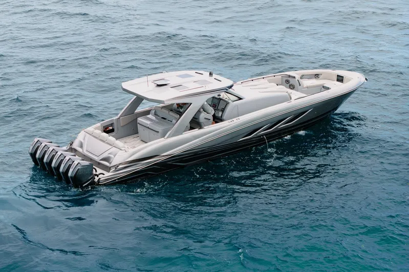  Yacht Photos Pics 2026 Deep Impact 499 Sport boat on open water, showcasing sleek design and powerful engines.