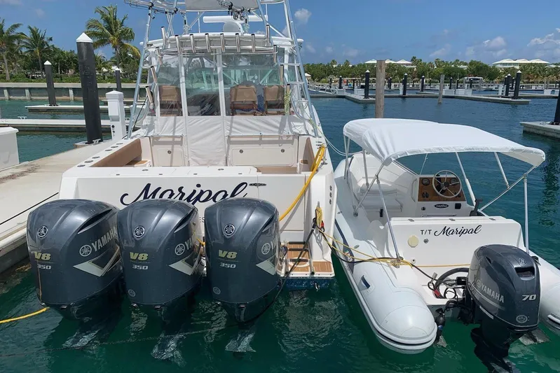Maripal Yacht Photos Pics 2008 Contender 38 Express boat docked with Yamaha V8 engines, clear skies, and palm trees.