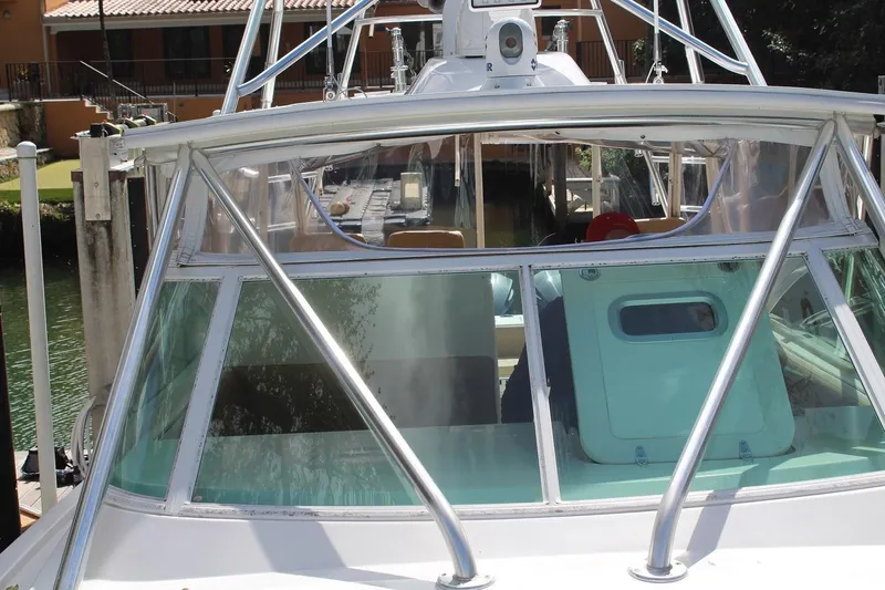 Maripal Yacht Photos Pics 2008 Contender 38 Express boat docked, featuring a sleek windshield and sturdy frame.