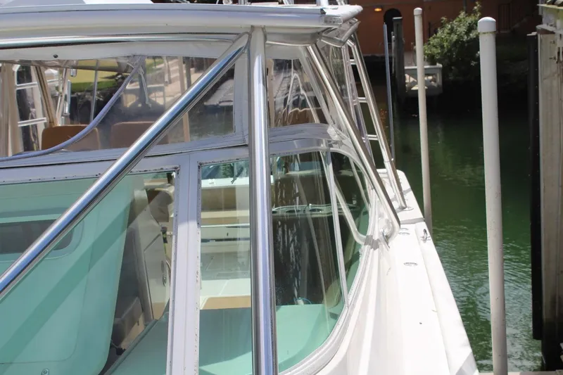 Maripal Yacht Photos Pics 2008 Contender 38 Express boat docked, showcasing sleek design and polished metalwork.