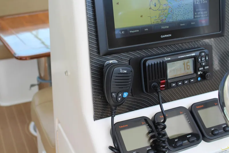 Maripal Yacht Photos Pics 2008 Contender 38 Express dashboard with Garmin GPS and Icom radio equipment.