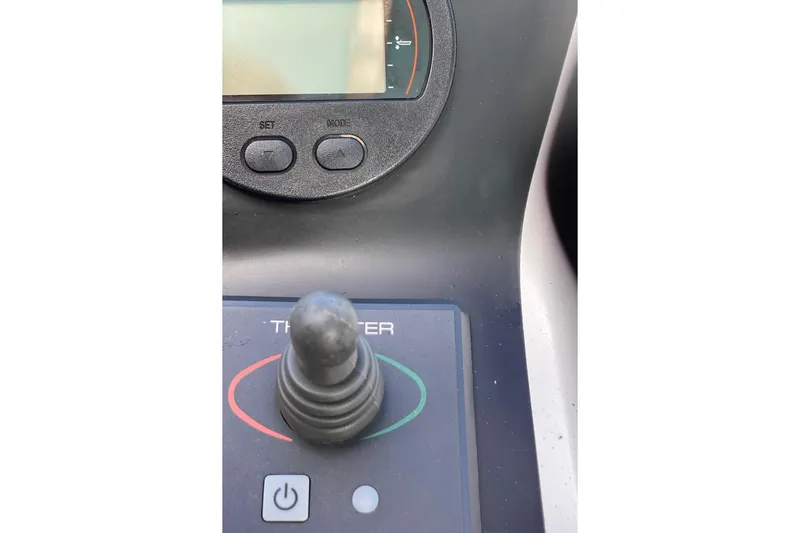 Maripal Yacht Photos Pics Control panel of a 2008 Contender 38 Express boat with joystick and display.