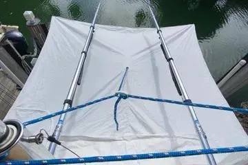 Maripal Yacht Photos Pics 2008 Contender 38 Express boat with a white canopy and blue ropes.