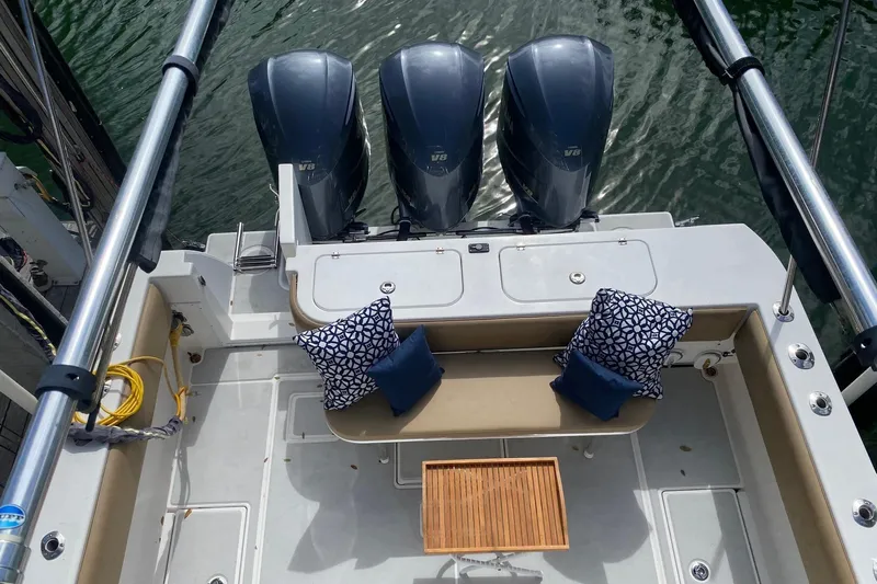 Maripal Yacht Photos Pics 2008 Contender 38 Express boat with triple engines and cushioned seating area.