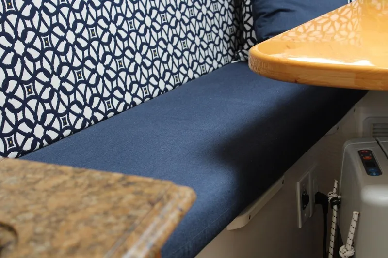 Maripal Yacht Photos Pics 2008 Contender 38 Express interior with patterned upholstery and wooden table.