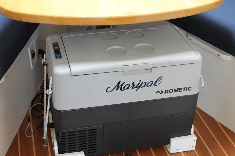 Maripal Yacht Photos Pics Dometic cooler under table on 2008 Contender 38 Express boat interior.