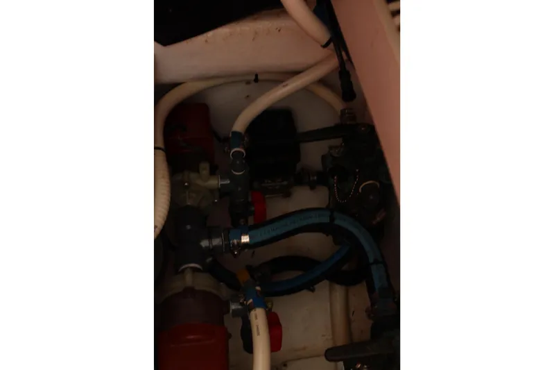 Maripal Yacht Photos Pics Engine compartment of a 2008 Contender 38 Express boat with visible hoses and fittings.
