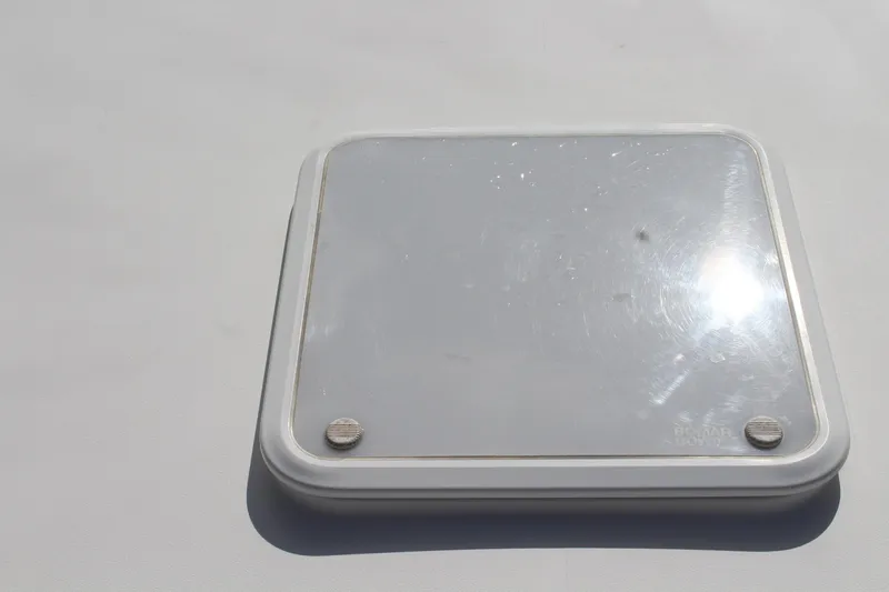 Maripal Yacht Photos Pics Hatch on 2008 Contender 38 Express boat, reflecting sunlight.