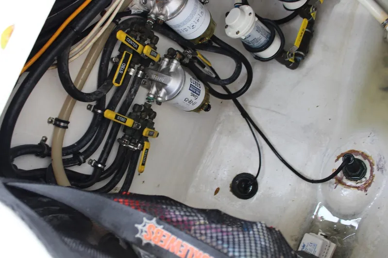 Maripal Yacht Photos Pics Engine compartment of 2008 Contender 38 Express with fuel lines and filters visible.