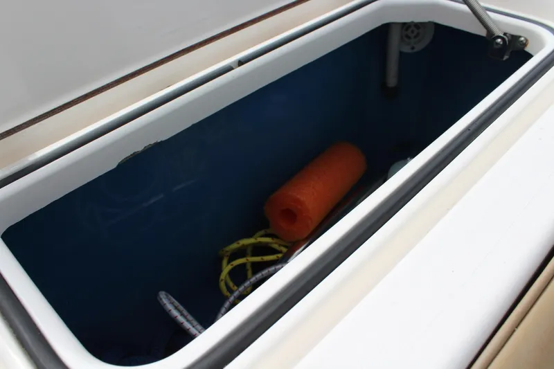 Maripal Yacht Photos Pics Storage compartment on 2008 Contender 38 Express boat with ropes and an orange float.