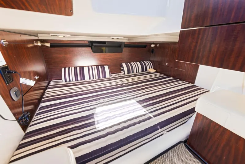  Yacht Photos Pics Interior of 2017 Monterey 378 Super Express with striped bedding.