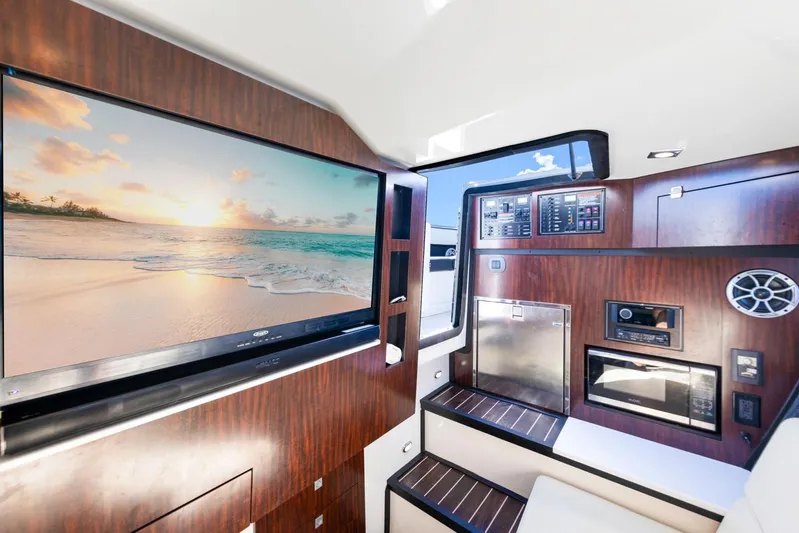  Yacht Photos Pics Interior of 2017 Monterey 378 Super Express with TV and wood paneling.