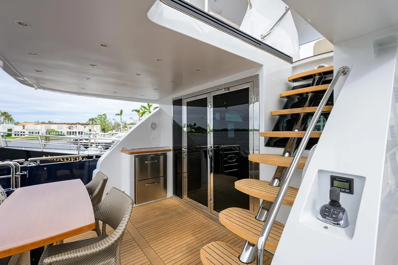 Indigo Yacht Photos Pics Luxurious 2018 Coastal Craft Concord 65 yacht deck with modern seating and staircase.