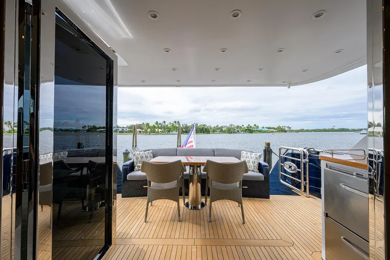 Indigo Yacht Photos Pics Luxurious 2018 Coastal Craft Concord 65 yacht deck with elegant seating and scenic water view.