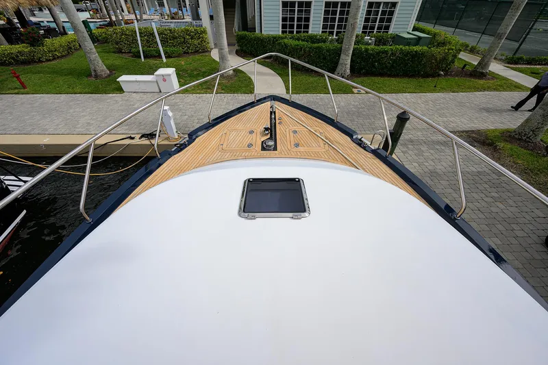 Indigo Yacht Photos Pics Bow view of 2018 Coastal Craft Concord 65 yacht docked at marina.