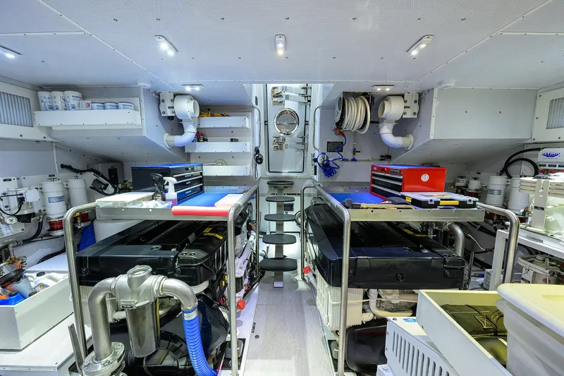 Indigo Yacht Photos Pics Engine room of 2018 Coastal Craft Concord 65 yacht, featuring advanced equipment and organized layout.