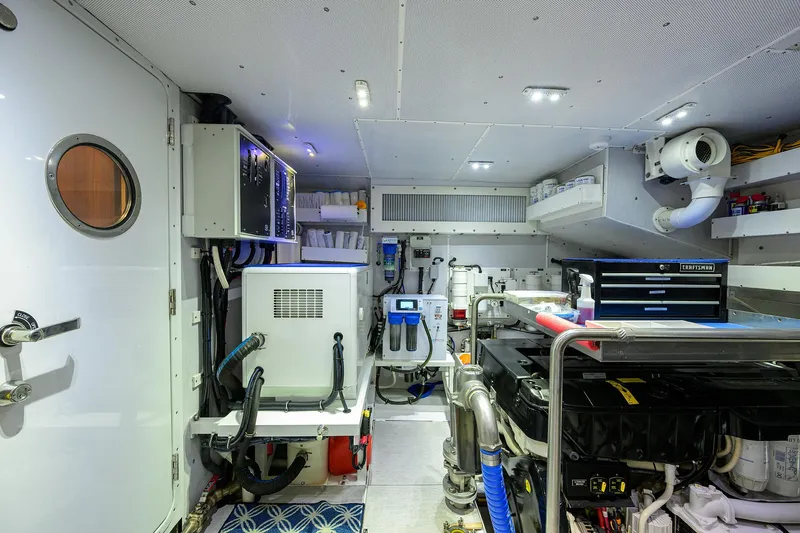 Indigo Yacht Photos Pics Engine room of 2018 Coastal Craft Concord 65 yacht, featuring modern equipment and organized layout.