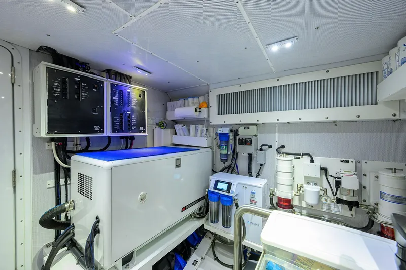 Indigo Yacht Photos Pics Engine room of 2018 Coastal Craft Concord 65 yacht, featuring advanced equipment and control panels.