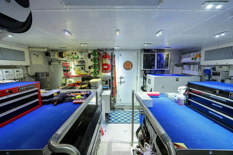 Indigo Yacht Photos Pics Interior of 2018 Coastal Craft Concord 65 yacht, featuring a well-equipped workshop with tool storage.