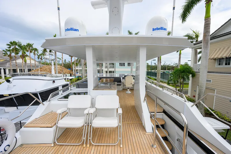 Indigo Yacht Photos Pics Luxurious 2018 Coastal Craft Concord 65 yacht deck with seating and navigation equipment.