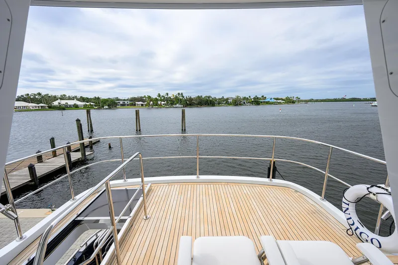 Indigo Yacht Photos Pics View from 2018 Coastal Craft Concord 65 yacht deck overlooking serene waterfront.