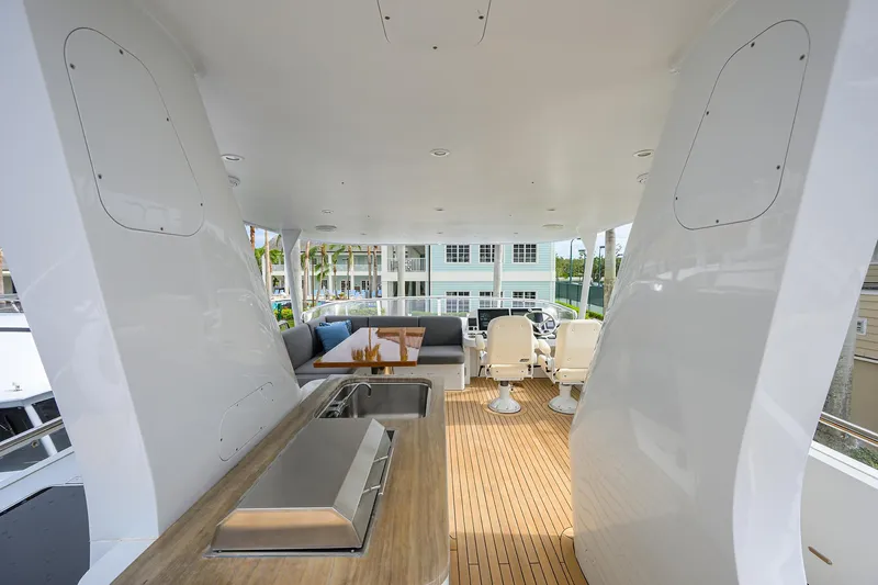 Indigo Yacht Photos Pics Luxurious 2018 Coastal Craft Concord 65 yacht interior with modern seating and outdoor kitchen.