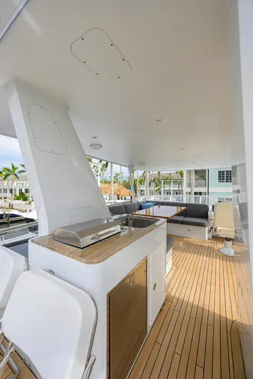 Indigo Yacht Photos Pics 2018 Coastal Craft Concord 65 yacht deck with seating and grill.