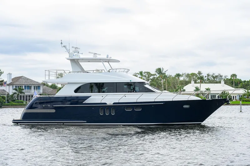 Indigo Yacht Photos Pics 2018 Coastal Craft Concord 65 yacht on calm water, luxury vessel with sleek design.