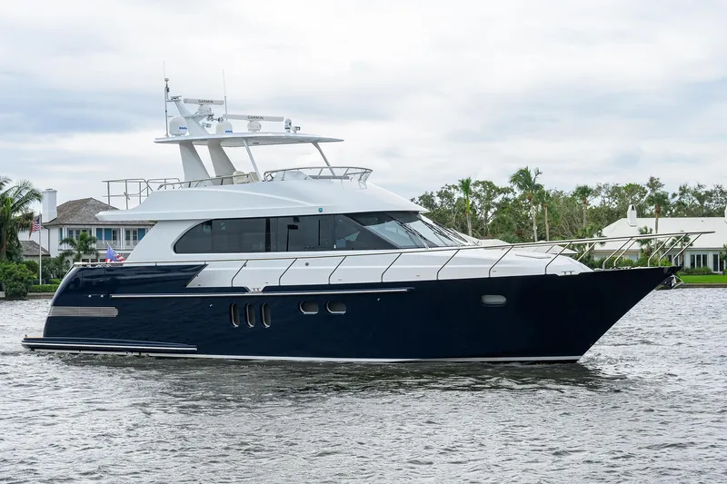 Indigo Yacht Photos Pics 2018 Coastal Craft Concord 65 yacht cruising on a calm waterway.