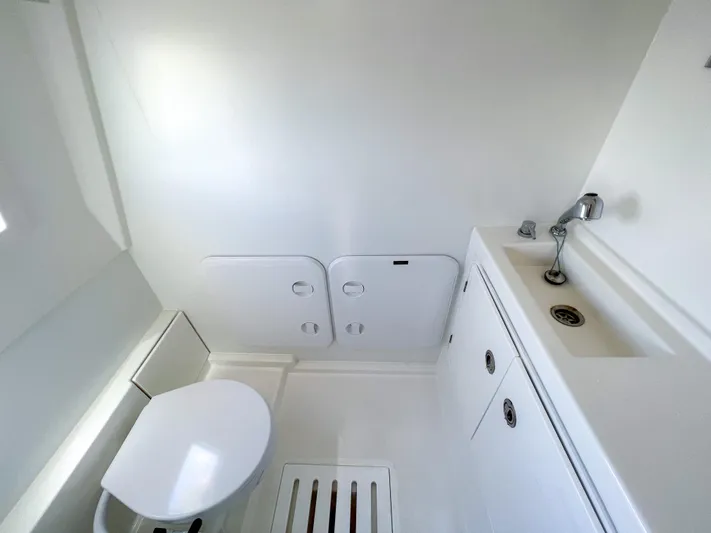  Yacht Photos Pics 2020 Prestige 520S yacht bathroom with modern white fixtures and compact design.