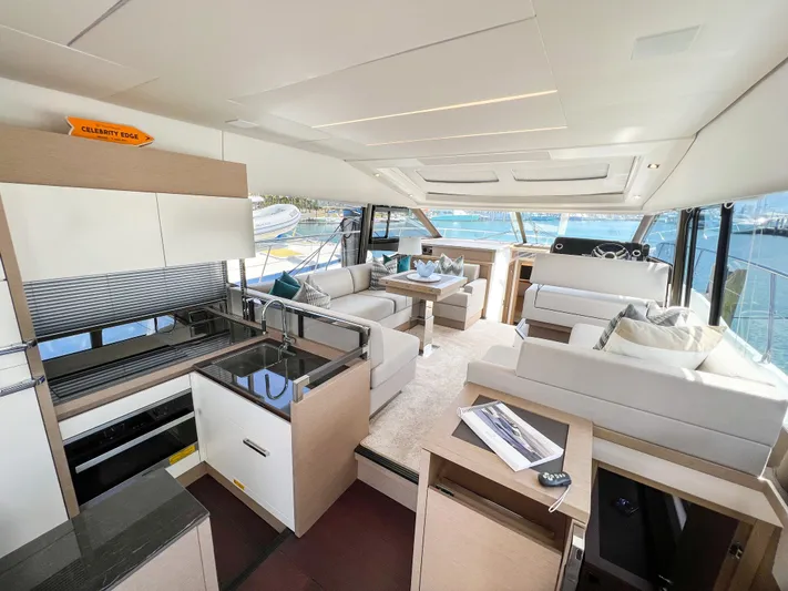  Yacht Photos Pics Luxurious interior of a 2020 Prestige 520S yacht with modern furnishings and panoramic windows.
