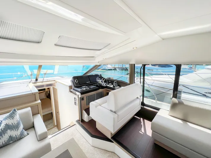  Yacht Photos Pics Luxurious interior of a 2020 Prestige 520S yacht with modern helm and seating.