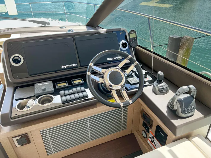  Yacht Photos Pics Helm of 2020 Prestige 520S yacht with Raymarine navigation system and modern controls.