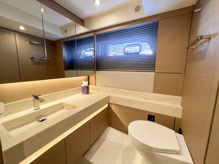  Yacht Photos Pics Luxurious bathroom in 2020 Prestige 520S yacht with modern fixtures and sleek design.