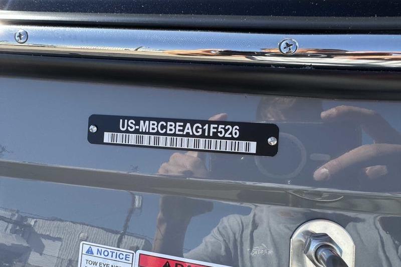 2026 MasterCraft NXT22 boat with visible hull identification number.