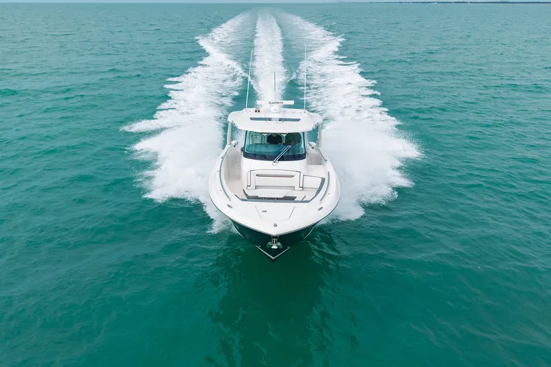  Yacht Photos Pics 2020 Tiara Sport 38 LS cruising on open turquoise waters.