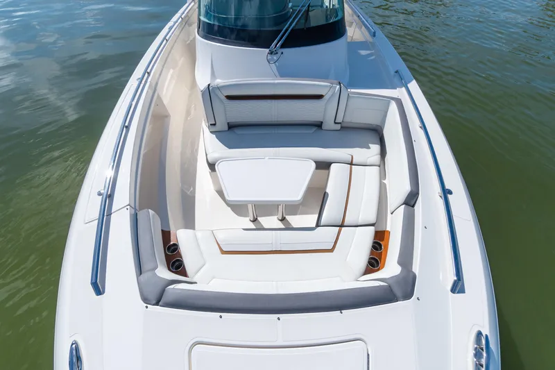  Yacht Photos Pics 2020 Tiara Sport 38 LS boat with luxurious seating and table on calm water.