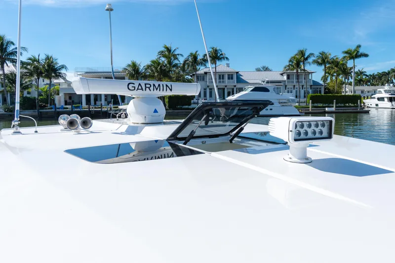  Yacht Photos Pics 2020 Tiara Sport 38 LS yacht with Garmin radar, docked near waterfront homes.