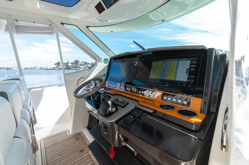  Yacht Photos Pics 2020 Tiara Sport 38 LS boat helm with advanced navigation system and luxurious interior.