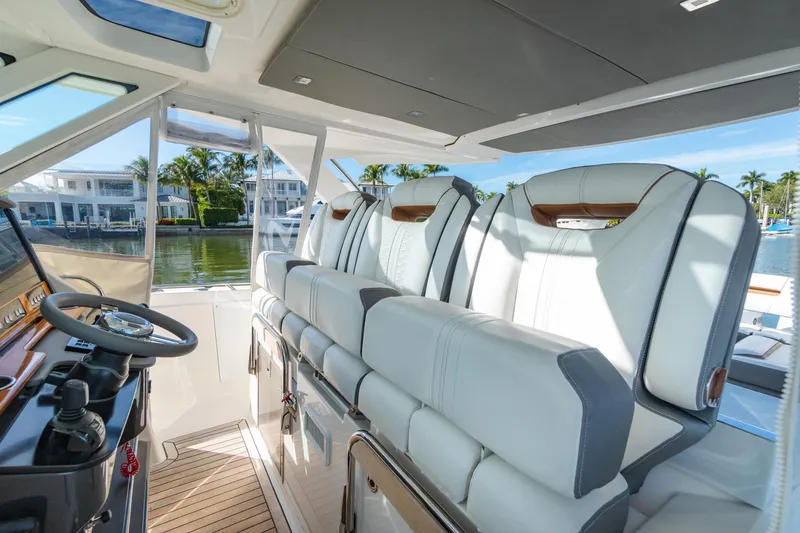  Yacht Photos Pics Interior of 2020 Tiara Sport 38 LS boat with luxurious seating and steering area.