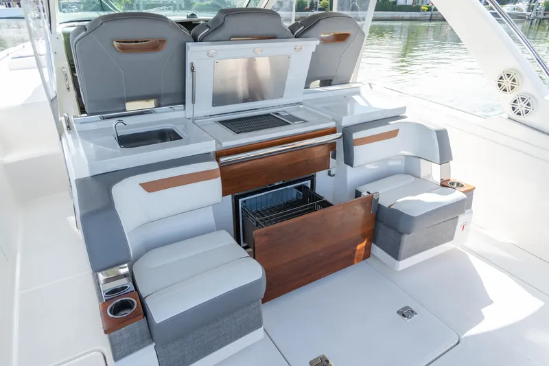  Yacht Photos Pics 2020 Tiara Sport 38 LS boat interior with seating, sink, and storage.