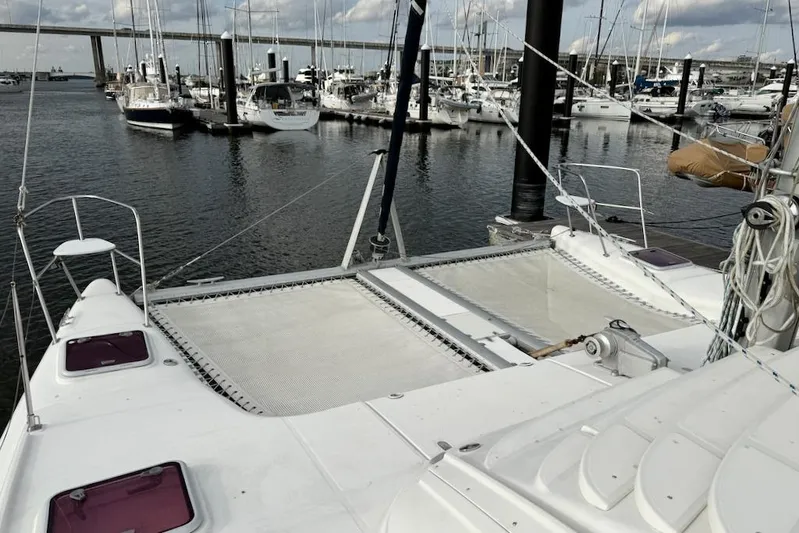 Zimbini Yacht Photos Pics 2006 Island Spirit 401 catamaran docked at marina with other boats.