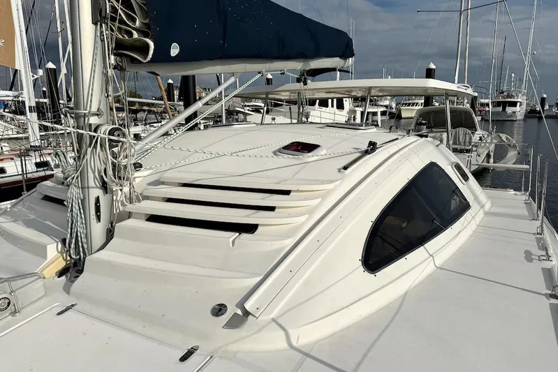 Zimbini Yacht Photos Pics Sailboat Island Spirit 401, 2006 model, docked at marina with clear sky.