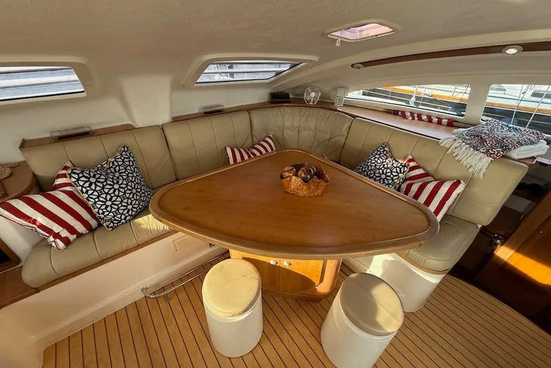 Zimbini Yacht Photos Pics Luxurious interior of 2006 Island Spirit 401 yacht with elegant seating and decorative pillows.