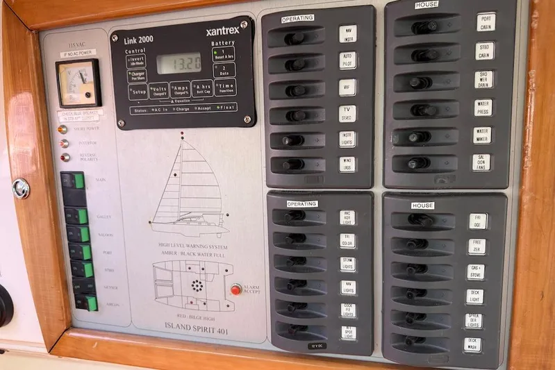 Zimbini Yacht Photos Pics Control panel of a 2006 Island Spirit 401 yacht with various switches and indicators.